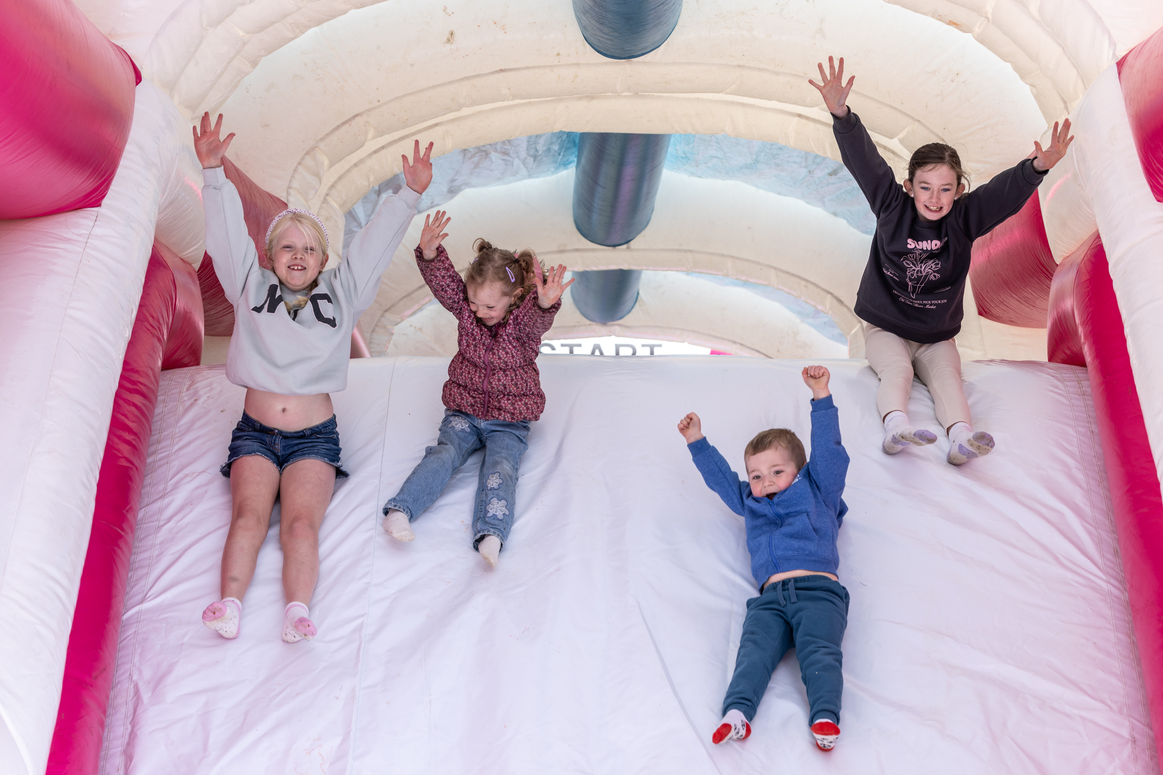 Children playing on bouncy castle.